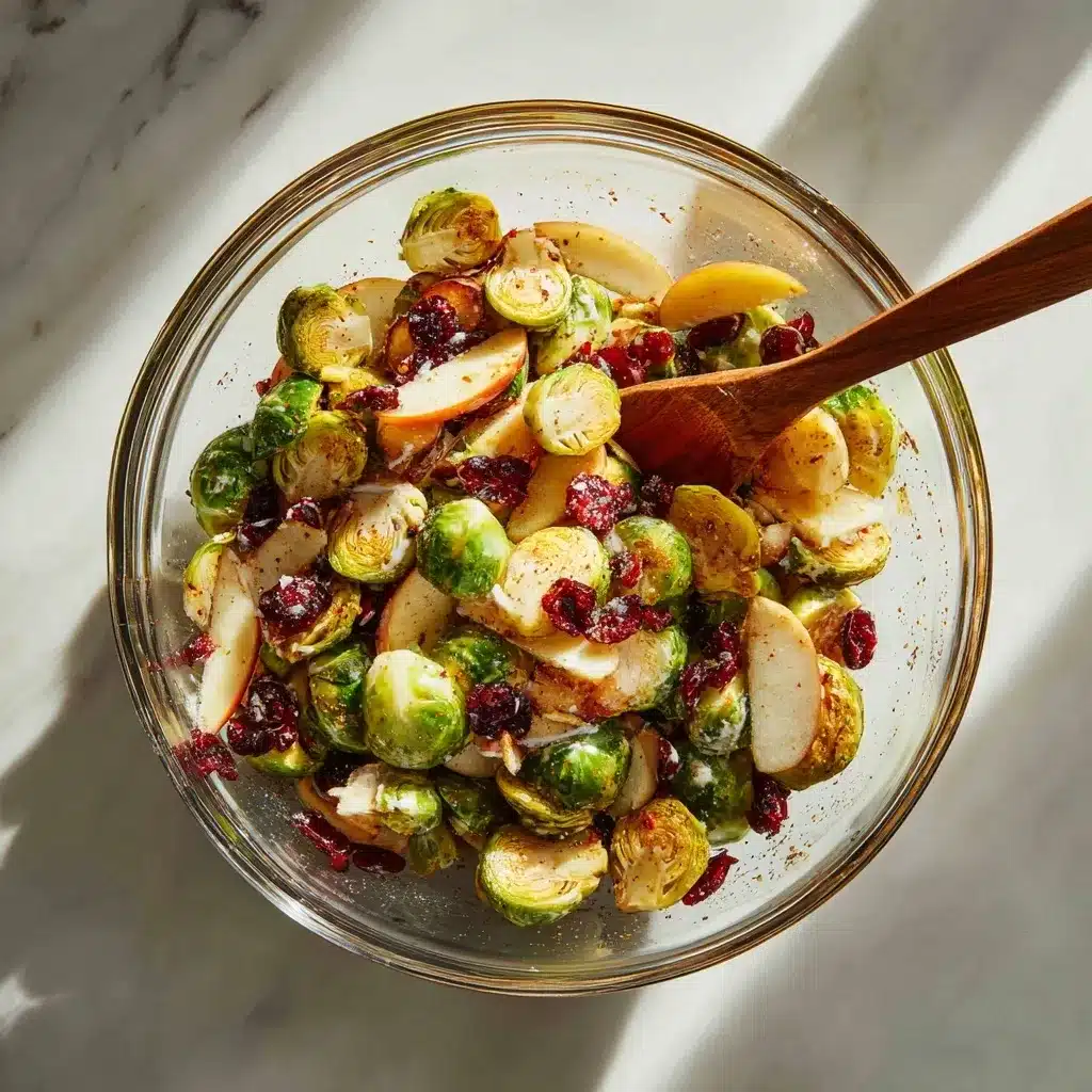 Maple-Roasted Brussels Sprouts with Apples and Cranberries 10 Trimming fresh Brussels sprouts on a wooden cutting board.