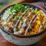 Street Corn Chicken Rice Bowl: A Flavorful and Easy Weeknight Dinner 7 Street corn chicken rice bowl with grilled chicken, rice, and creamy elote topping